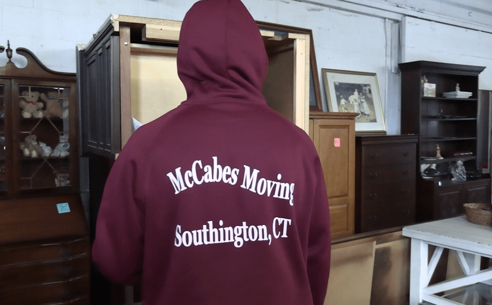 McCabe's Moving crew member carefully handling antique furniture